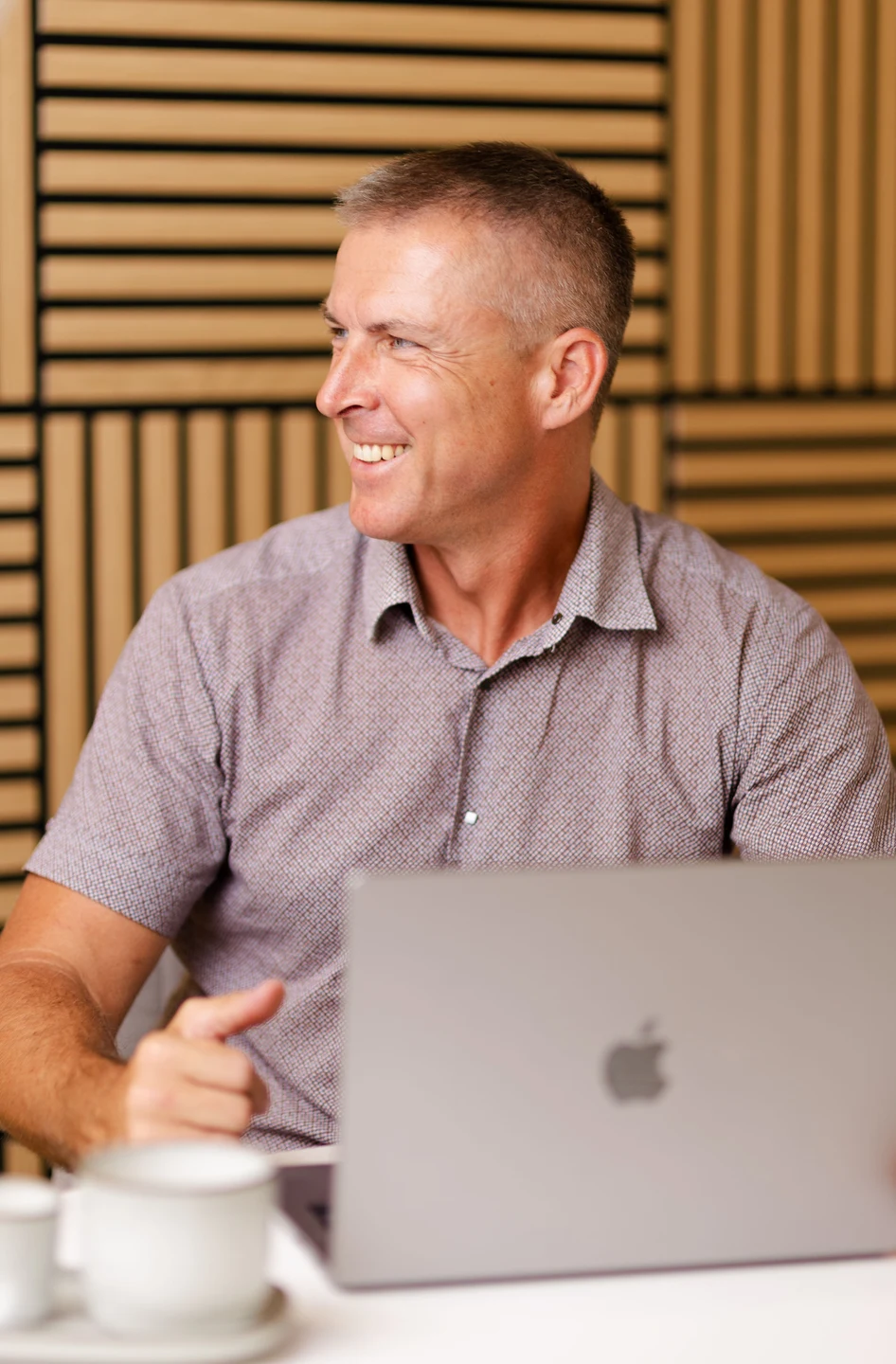 Oleksii Sologub — Strategic Advisor in Premium IOL Adoption Oleksii Sologub smiling during a conversation at his laptop